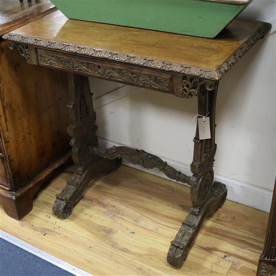 A 19th century Anglo-Indian ladies carved hardwood writing table W.76cm.